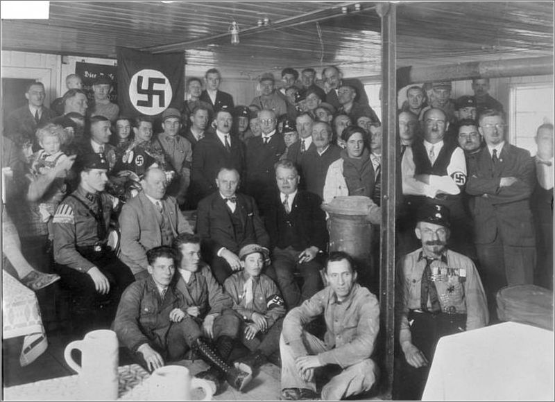 Hitler with NSDAP members at the Brown House in 1930